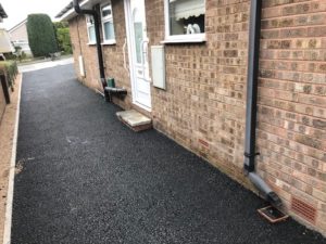 driveway and side of a bungalow